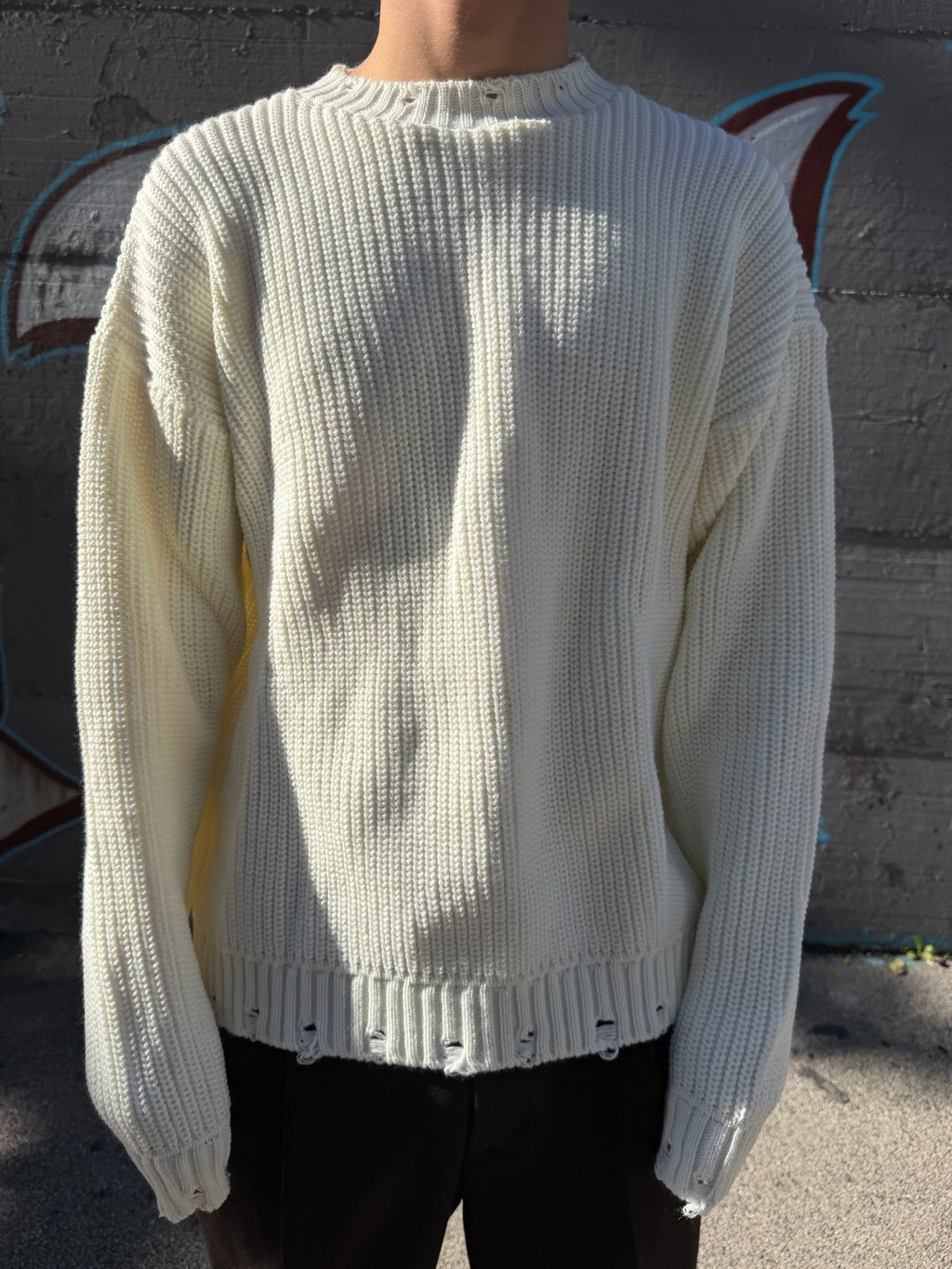 PULLOVER CON ABRASIONI